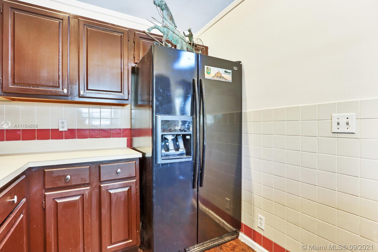 6247 Robinson Street Jupiter, FL 33458 - Photo 14 of 56 a bathroom with a sink and a mirror