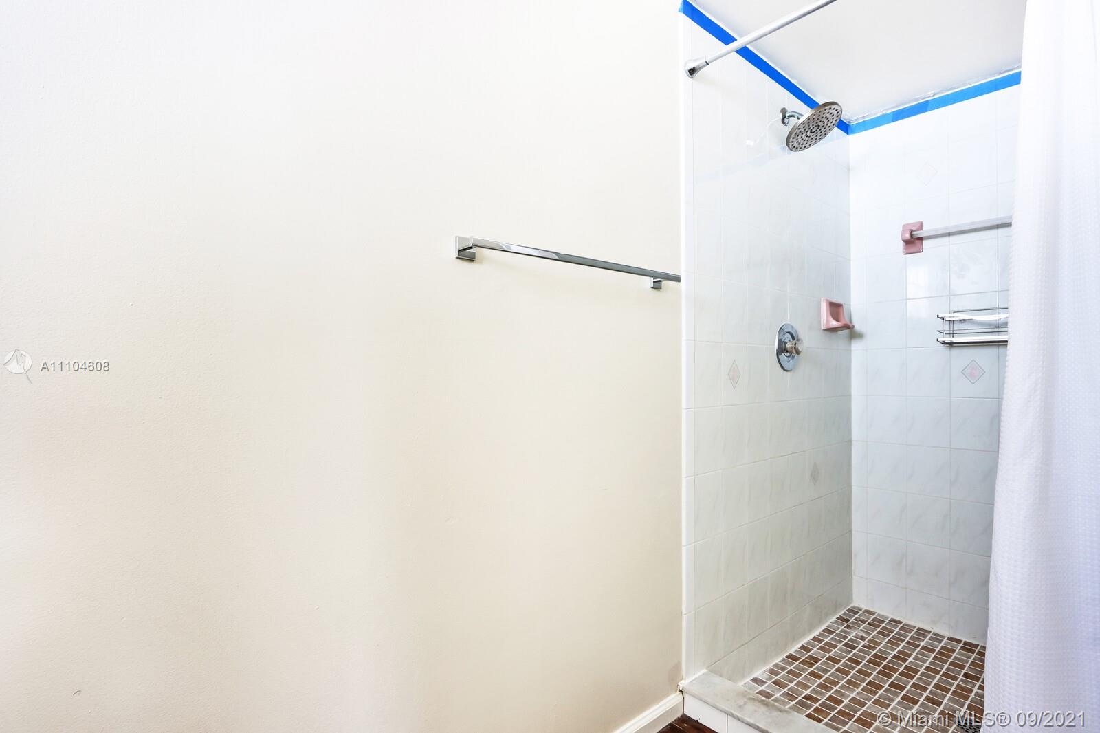 6247 Robinson Street Jupiter, FL 33458 - Photo 18 of 56 a bathroom with a shower