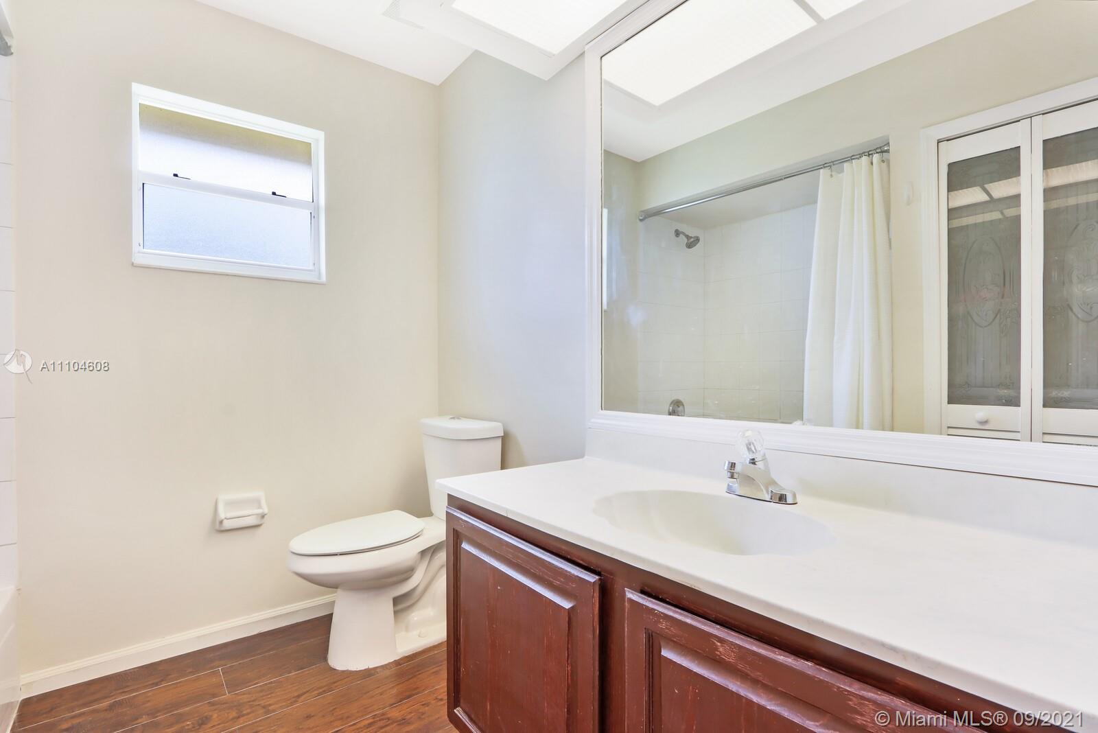 6247 Robinson Street Jupiter, FL 33458 - Photo 20 of 56 a bathroom with a sink and a toilet