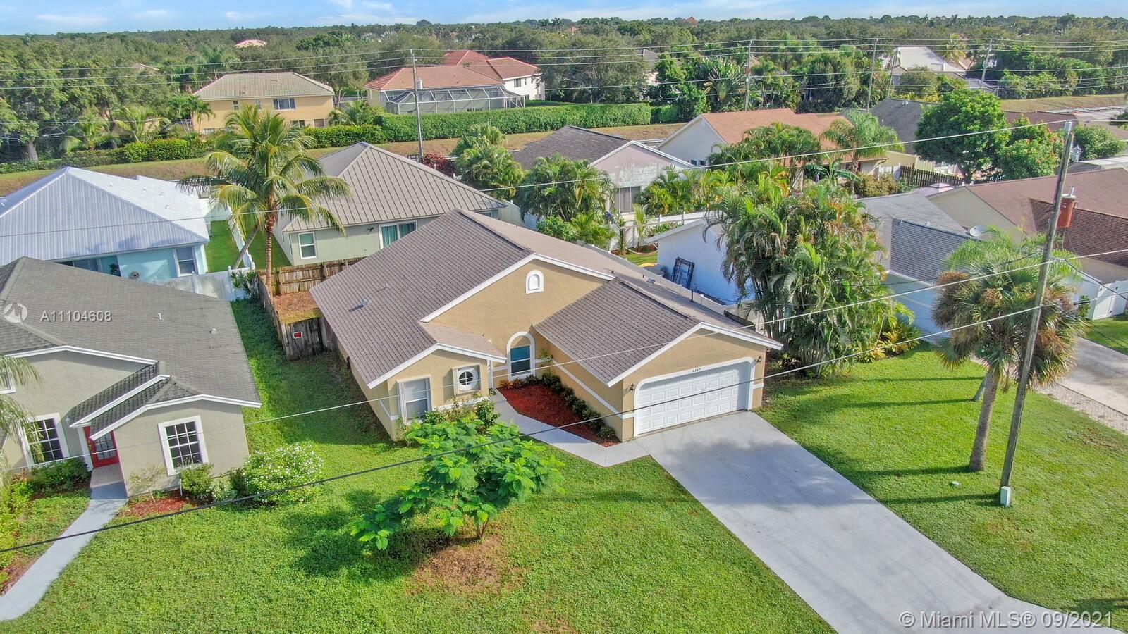6247 Robinson Street Jupiter, FL 33458 - Photo 26 of 56 an aerial view of a house with a garden