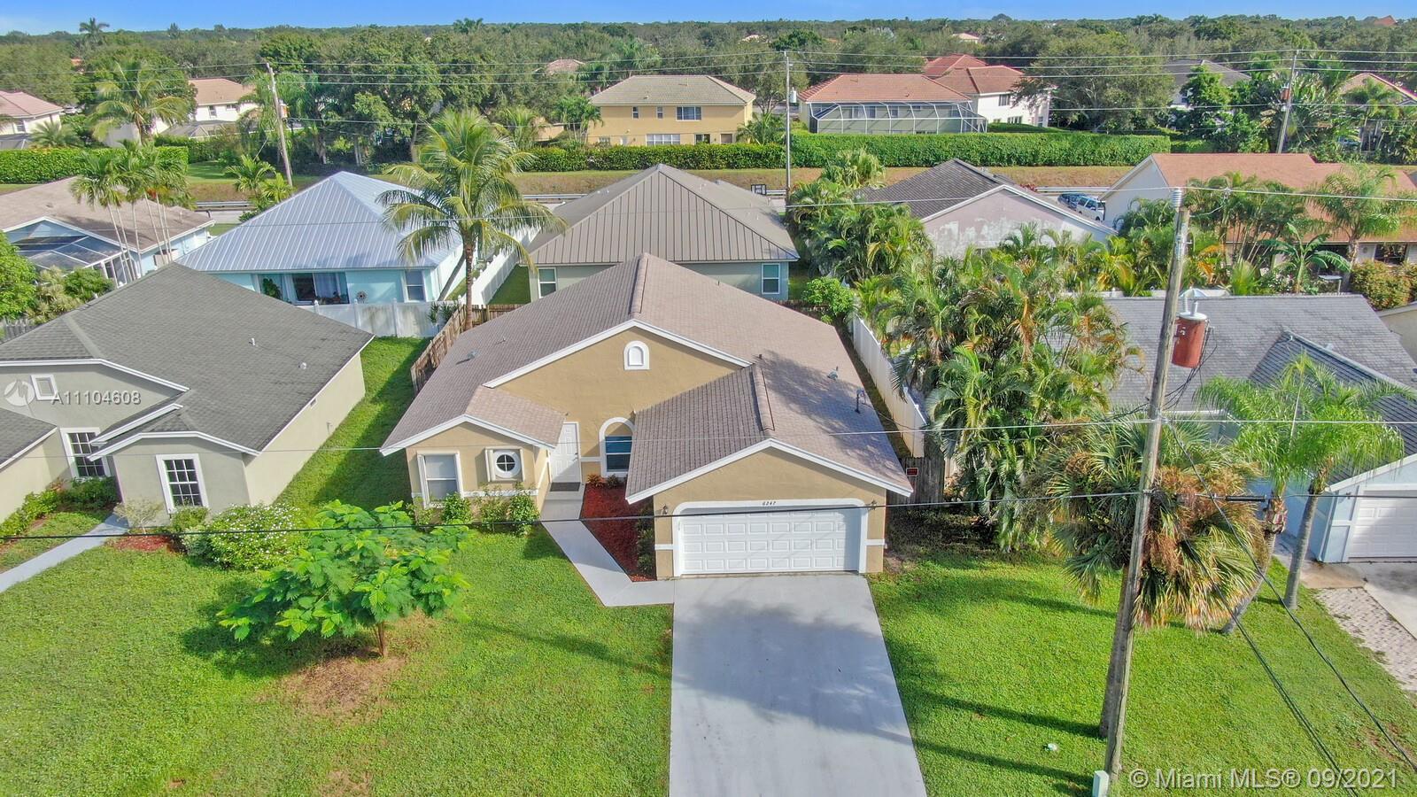 6247 Robinson Street Jupiter, FL 33458 - Photo 27 of 56 an aerial view of multiple houses