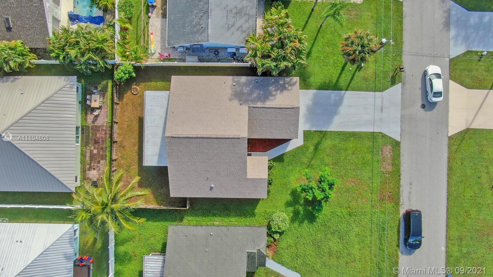 6247 Robinson Street Jupiter, FL 33458 - Photo 29 of 56 an aerial view of a house with a yard