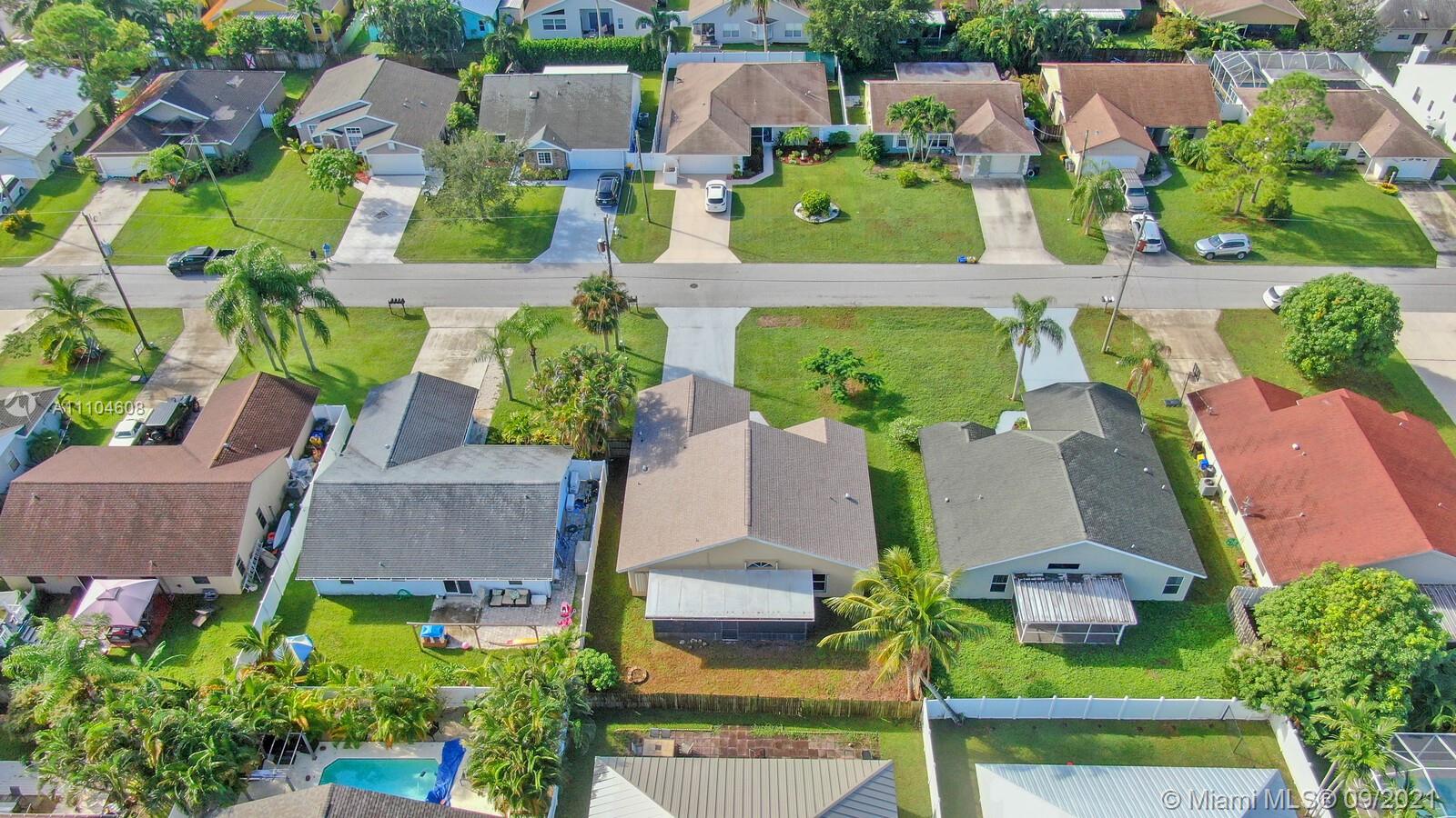 6247 Robinson Street Jupiter, FL 33458 - Photo 31 of 56 an aerial view of residential houses with outdoor space and street view