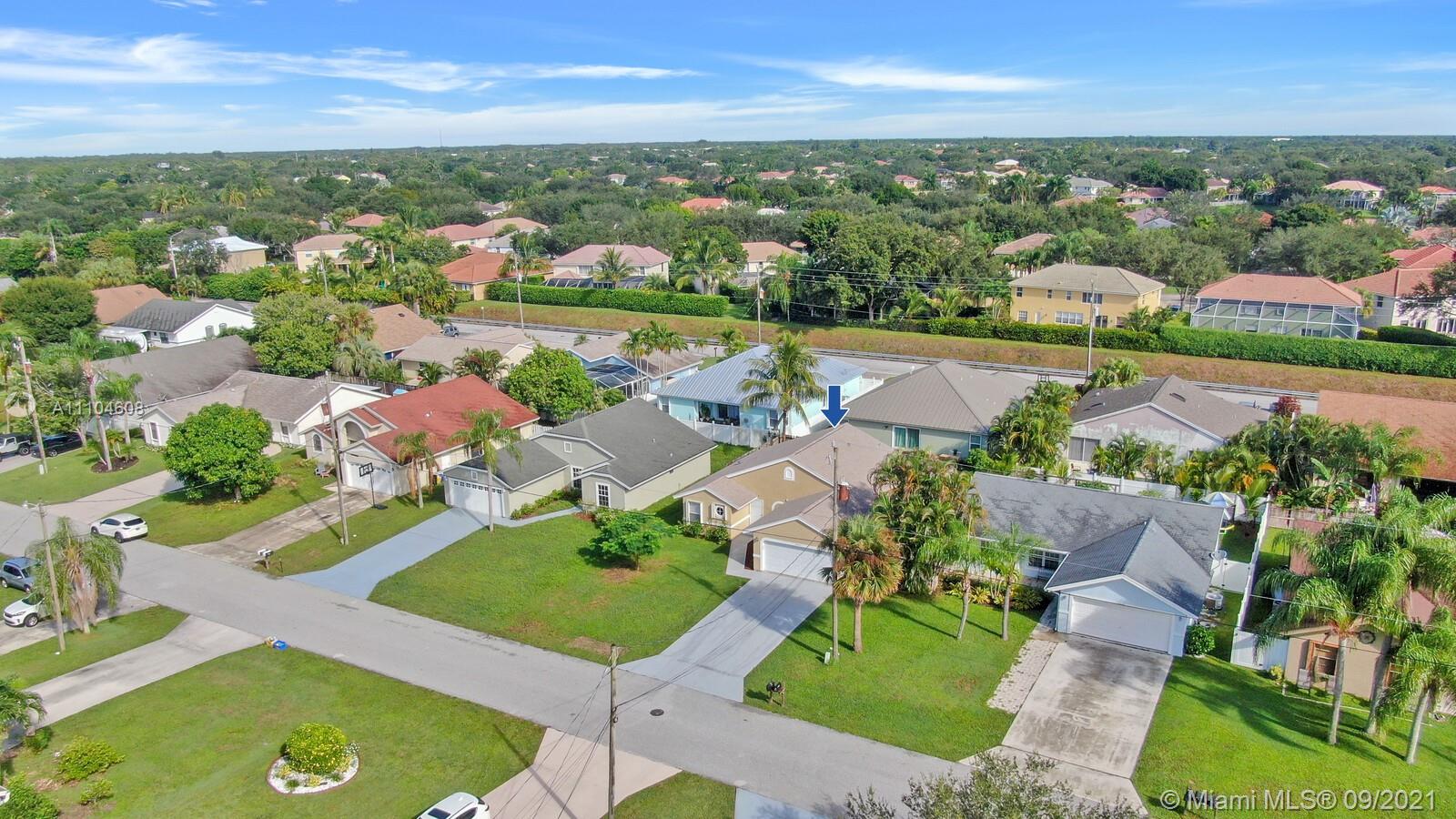 6247 Robinson Street Jupiter, FL 33458 - Photo 32 of 56 an aerial view of residential houses with outdoor space