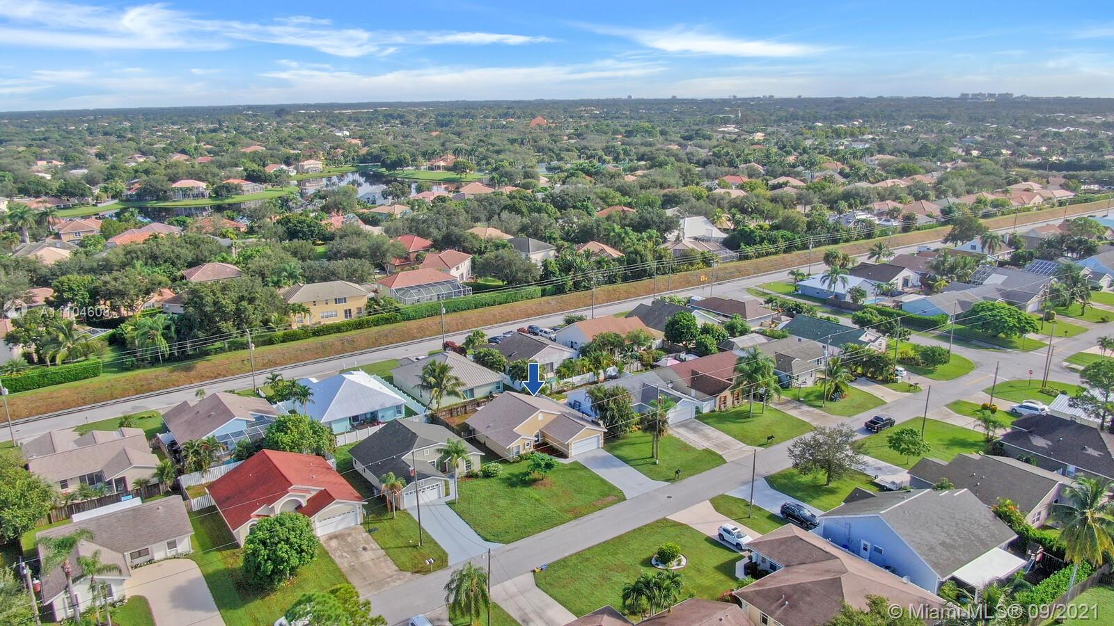 6247 Robinson Street Jupiter, FL 33458 - Photo 35 of 56 an aerial view of residential building with outdoor space