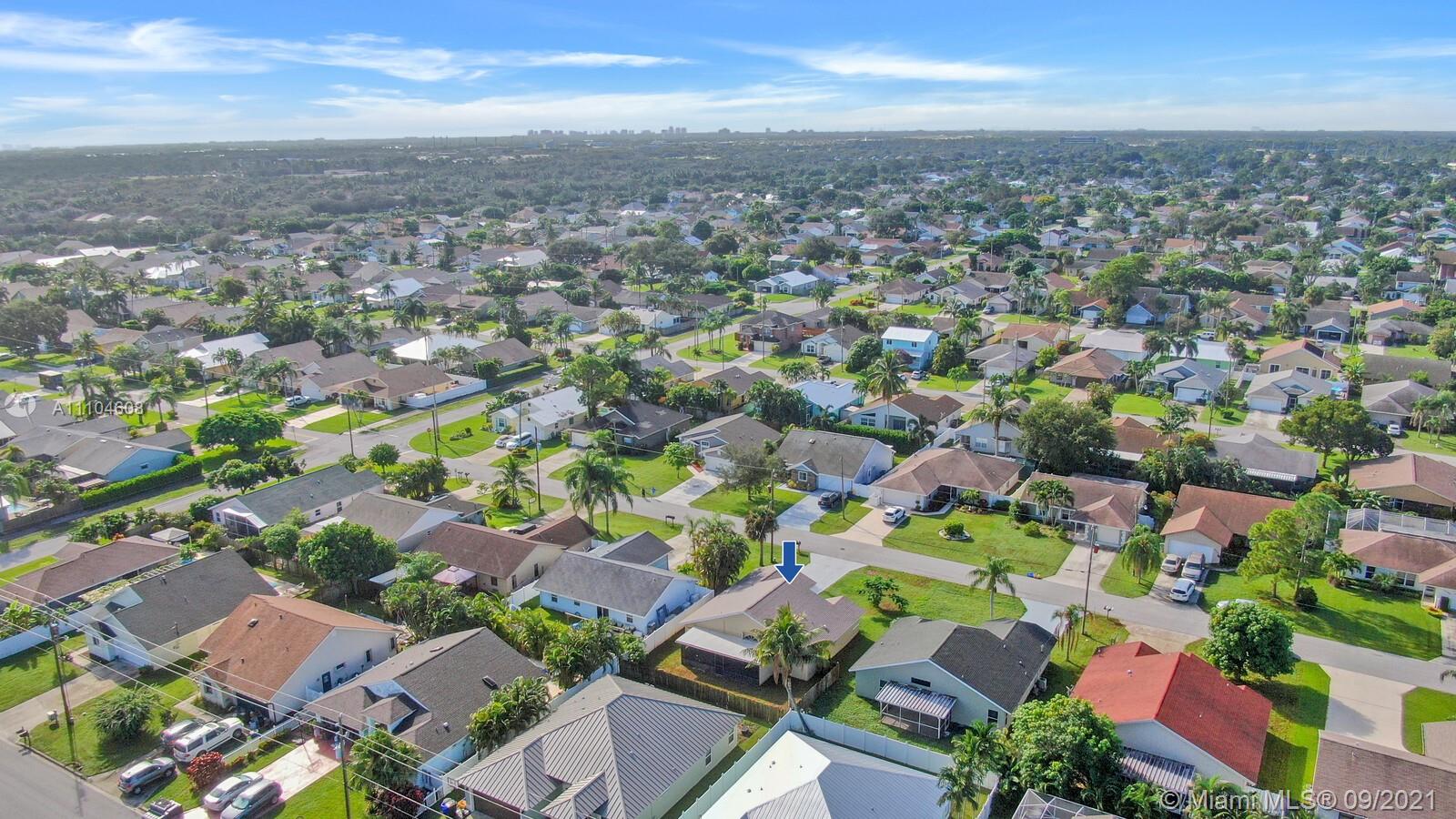 6247 Robinson Street Jupiter, FL 33458 - Photo 38 of 56 an aerial view of residential houses with outdoor space