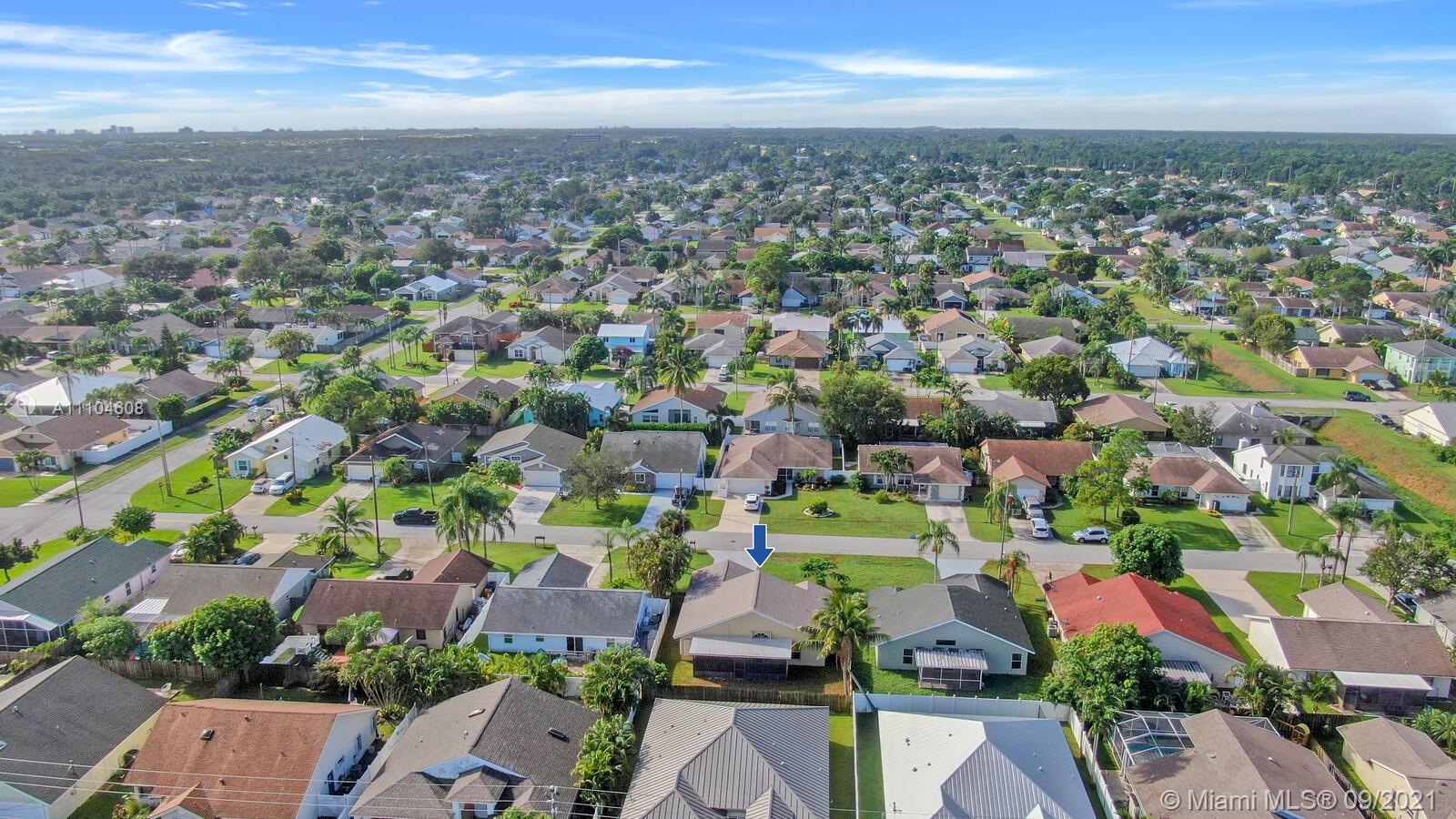 6247 Robinson Street Jupiter, FL 33458 - Photo 39 of 56 an aerial view of residential houses with outdoor space