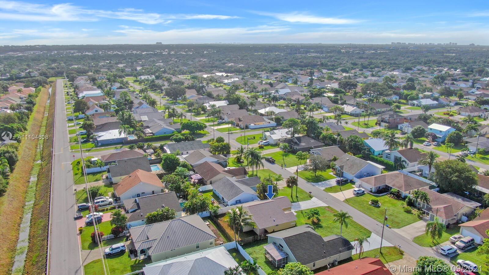 6247 Robinson Street Jupiter, FL 33458 - Photo 41 of 56 an aerial view of residential houses with outdoor space