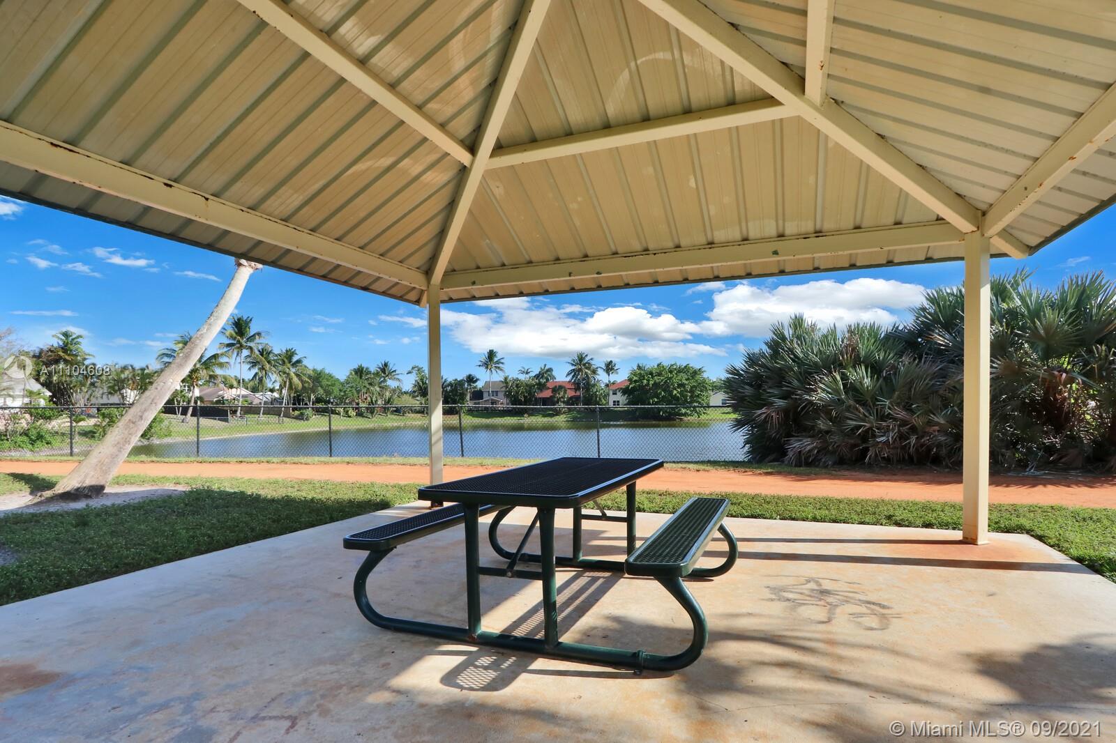 6247 Robinson Street Jupiter, FL 33458 - Photo 51 of 56 a view of swimming pool with outdoor seating and yard