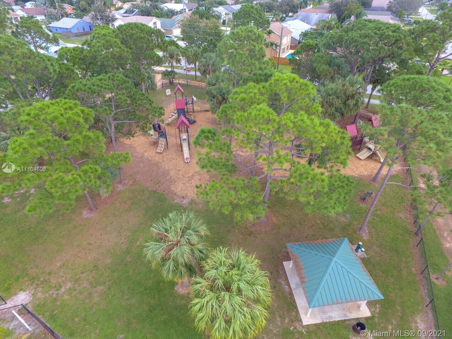 6247 Robinson Street Jupiter, FL 33458 - Photo 54 of 56 an aerial view of a house with a yard