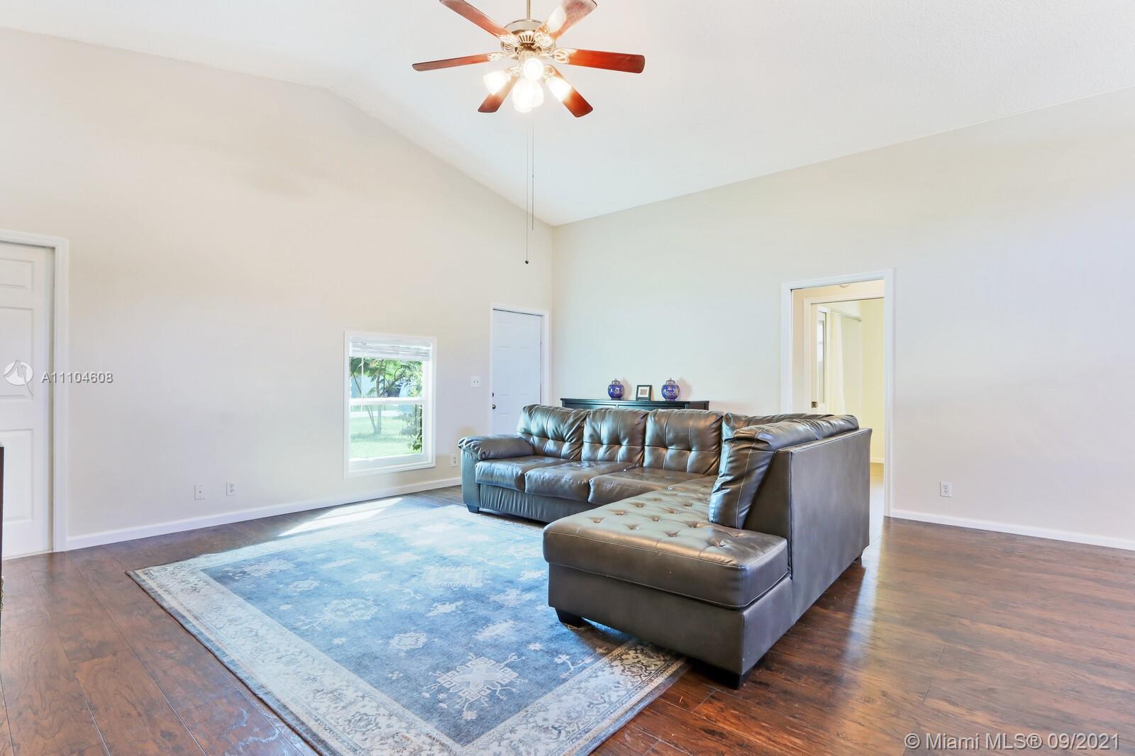 6247 Robinson Street Jupiter, FL 33458 - Photo 9 of 56 a living room with furniture and a window