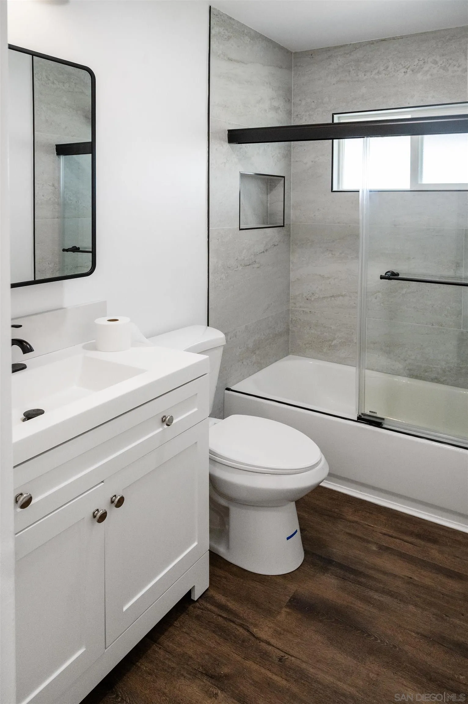 13504 Willow Road Lakeside, CA 92040 - Photo 8 of 9 a bathroom with a toilet sink and shower