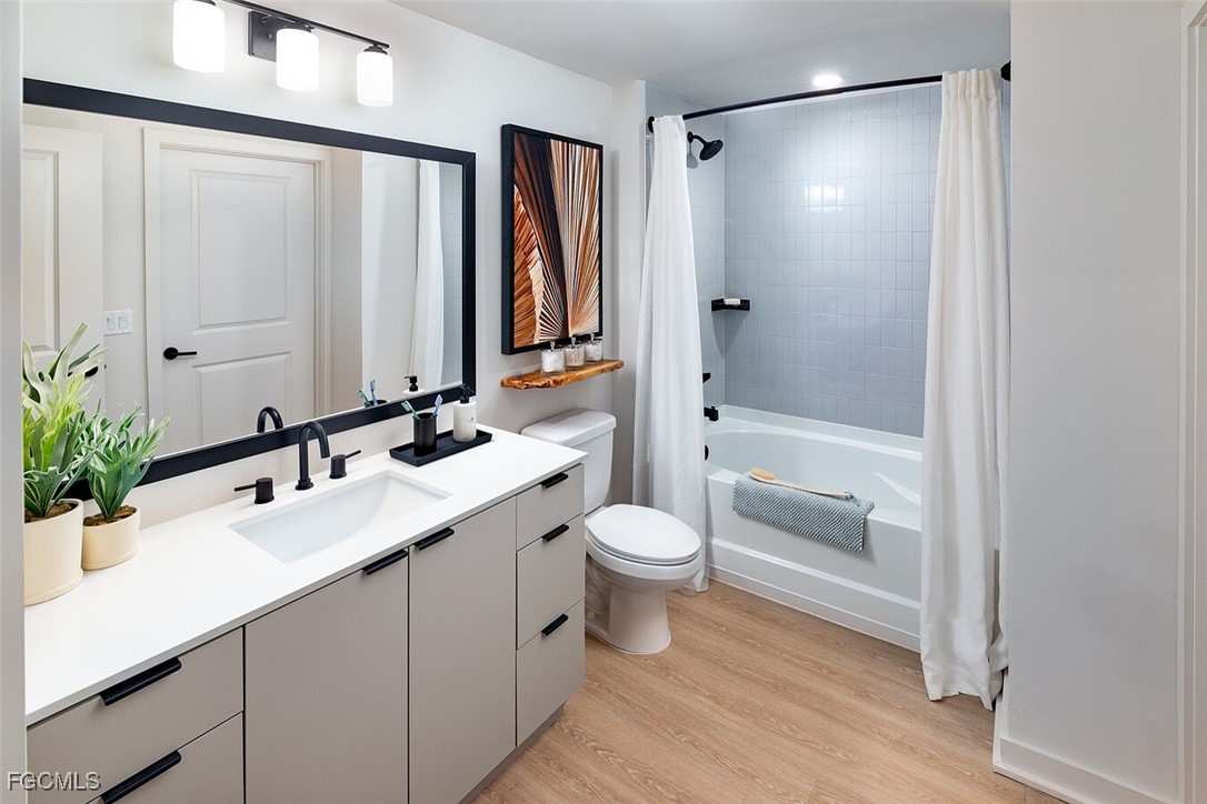 6026 Whitaker Road, Unit A1 Naples, FL 34112 - Photo 21 of 23 a bathroom with a sink a toilet and shower
