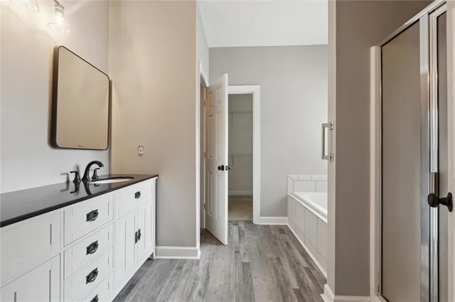 a bathroom with a double vanity sink and mirror