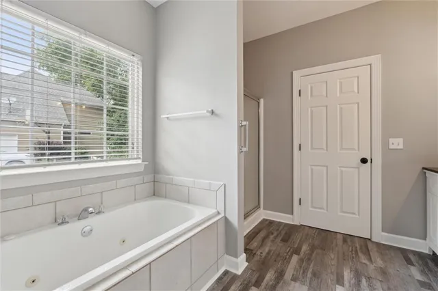 a bathroom with a bathtub and a sink