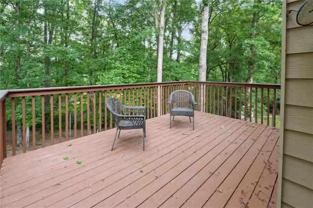 a view of balcony with deck and wooden floor