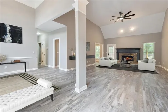 a living room with furniture and a fireplace