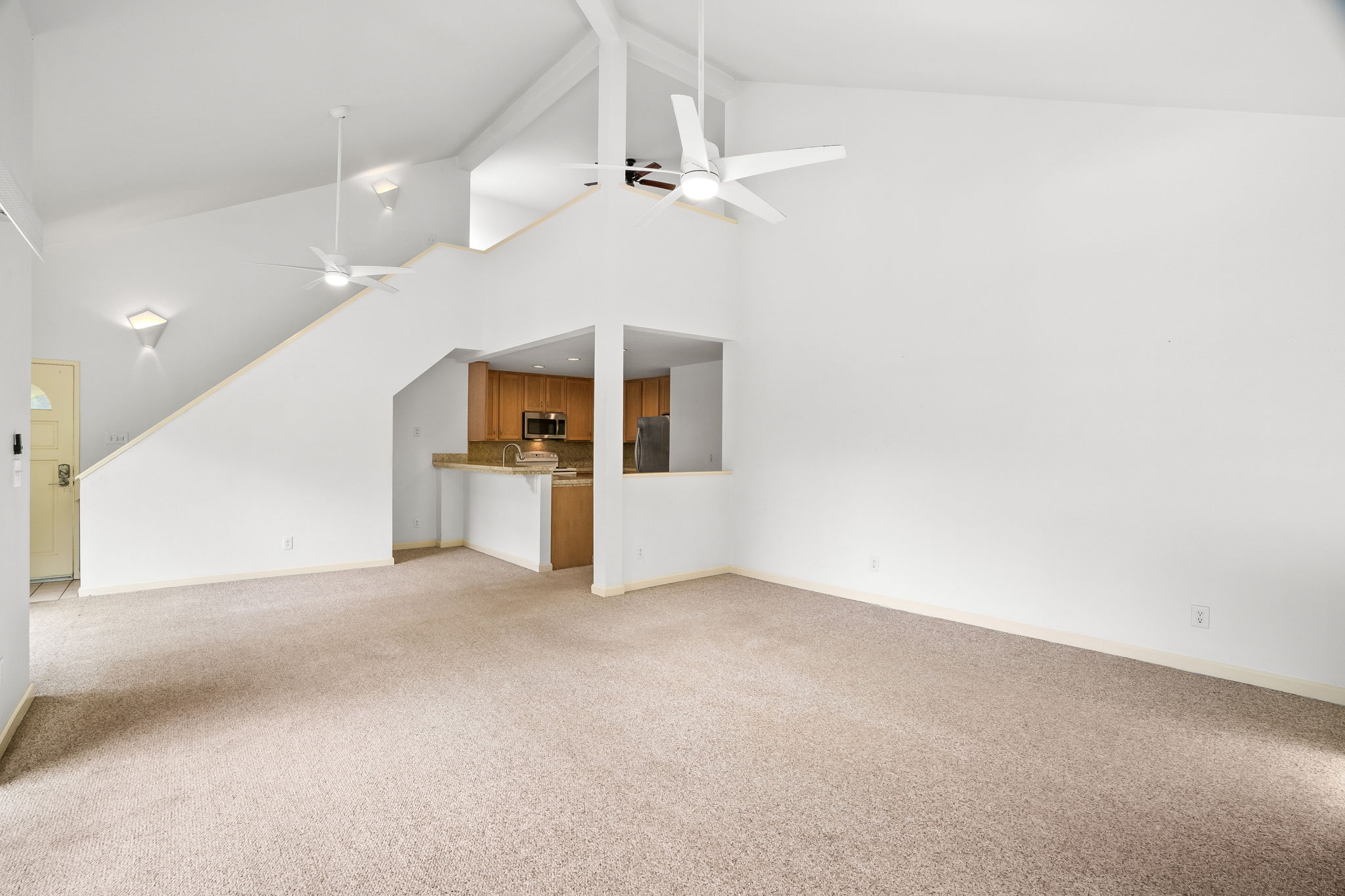 1831 Poipu Road, Unit 324 Koloa, HI 96756 - Photo 3 of 10 a view of a big room with entryway and windows
