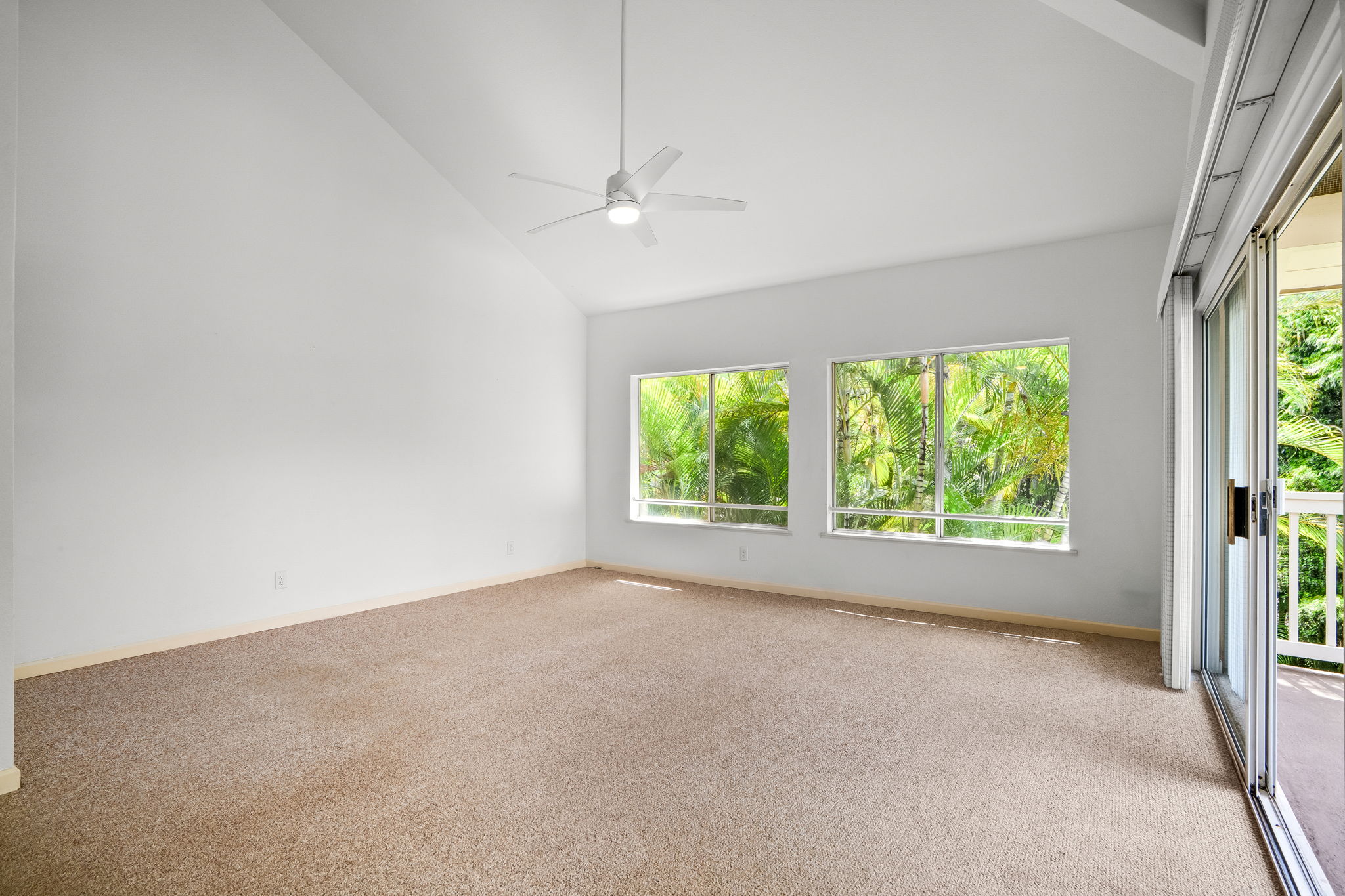 1831 Poipu Road, Unit 324 Koloa, HI 96756 - Photo 4 of 10 an empty room with a window and a ceiling fan