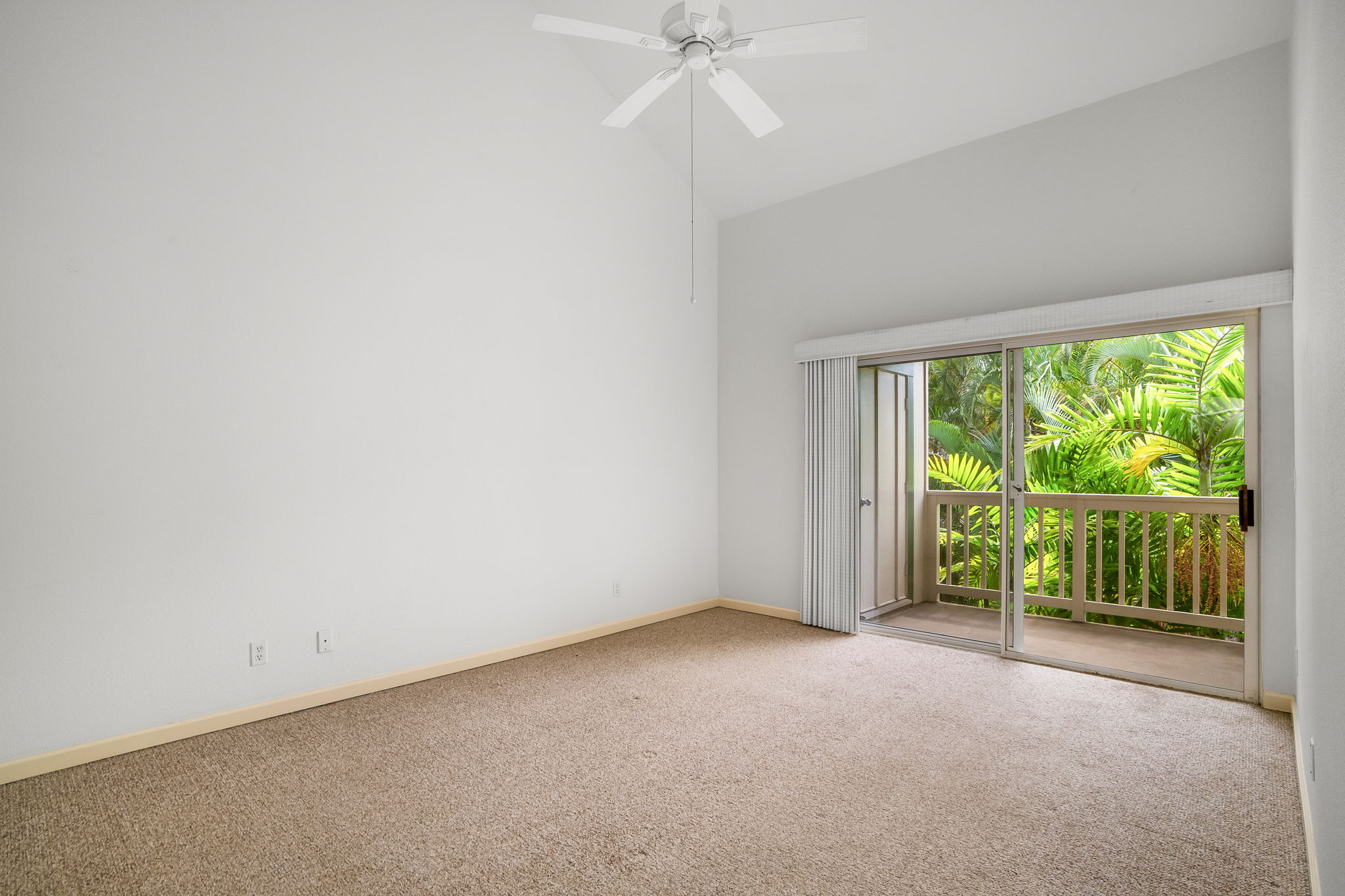 1831 Poipu Road, Unit 324 Koloa, HI 96756 - Photo 5 of 10 an empty room with a window and a ceiling fan