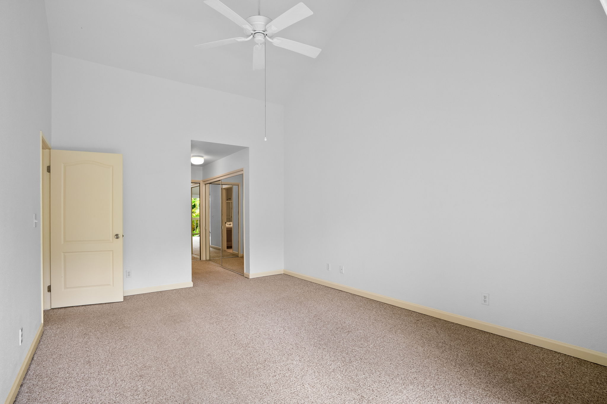 1831 Poipu Road, Unit 324 Koloa, HI 96756 - Photo 6 of 10 a view of an empty room and a chandelier fan