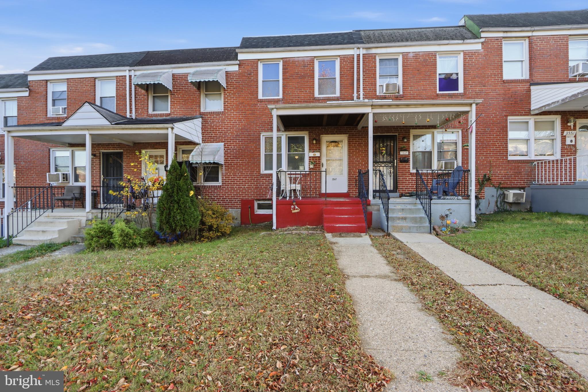 Charming brick townhomes with inviting porches.