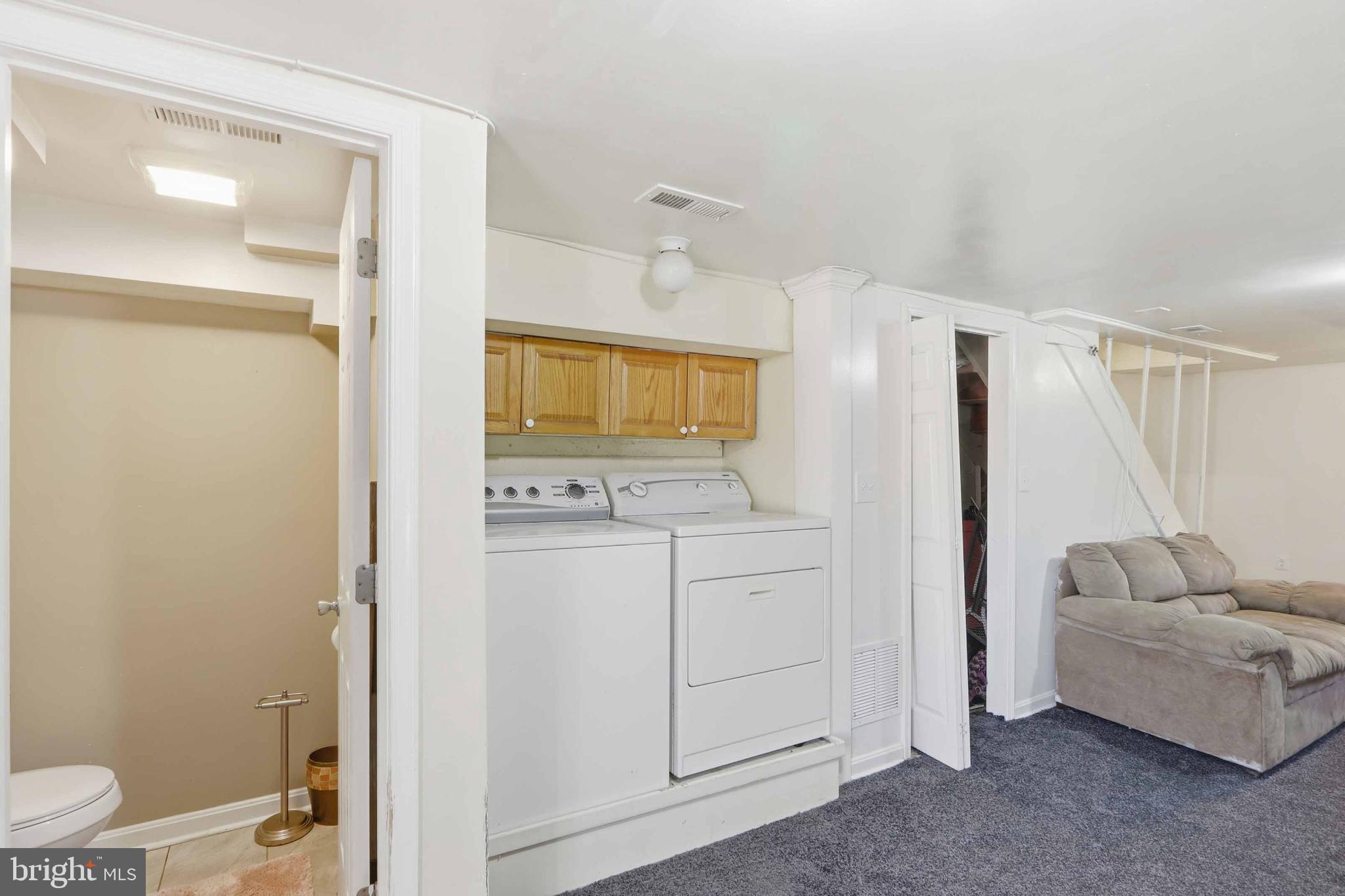 3547 Benzinger Road Baltimore, MD 21229 - Photo 14 of 24 Versatile basement with laundry and cozy space.