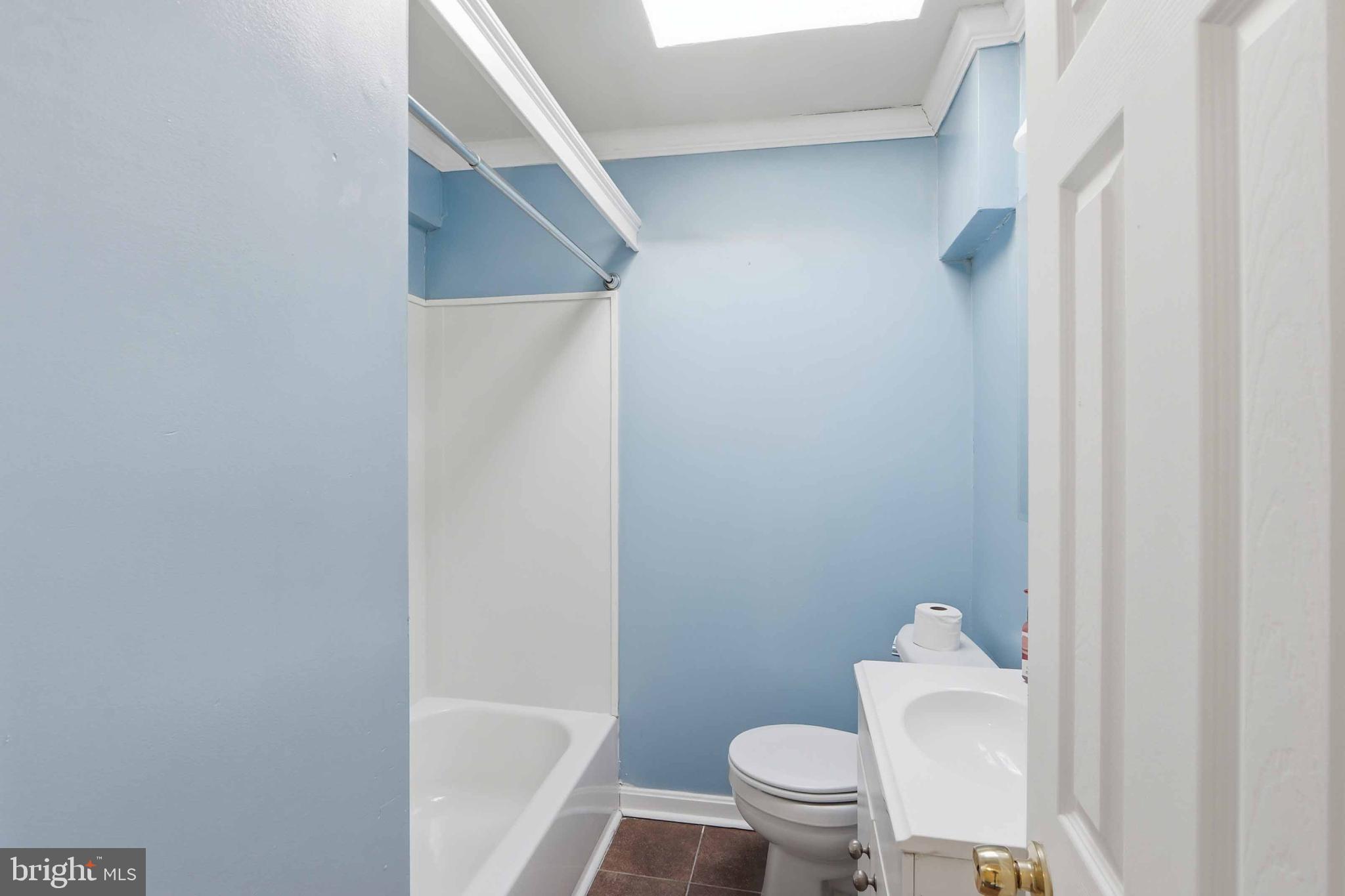 3547 Benzinger Road Baltimore, MD 21229 - Photo 18 of 24 a white toilet sitting next to a shower