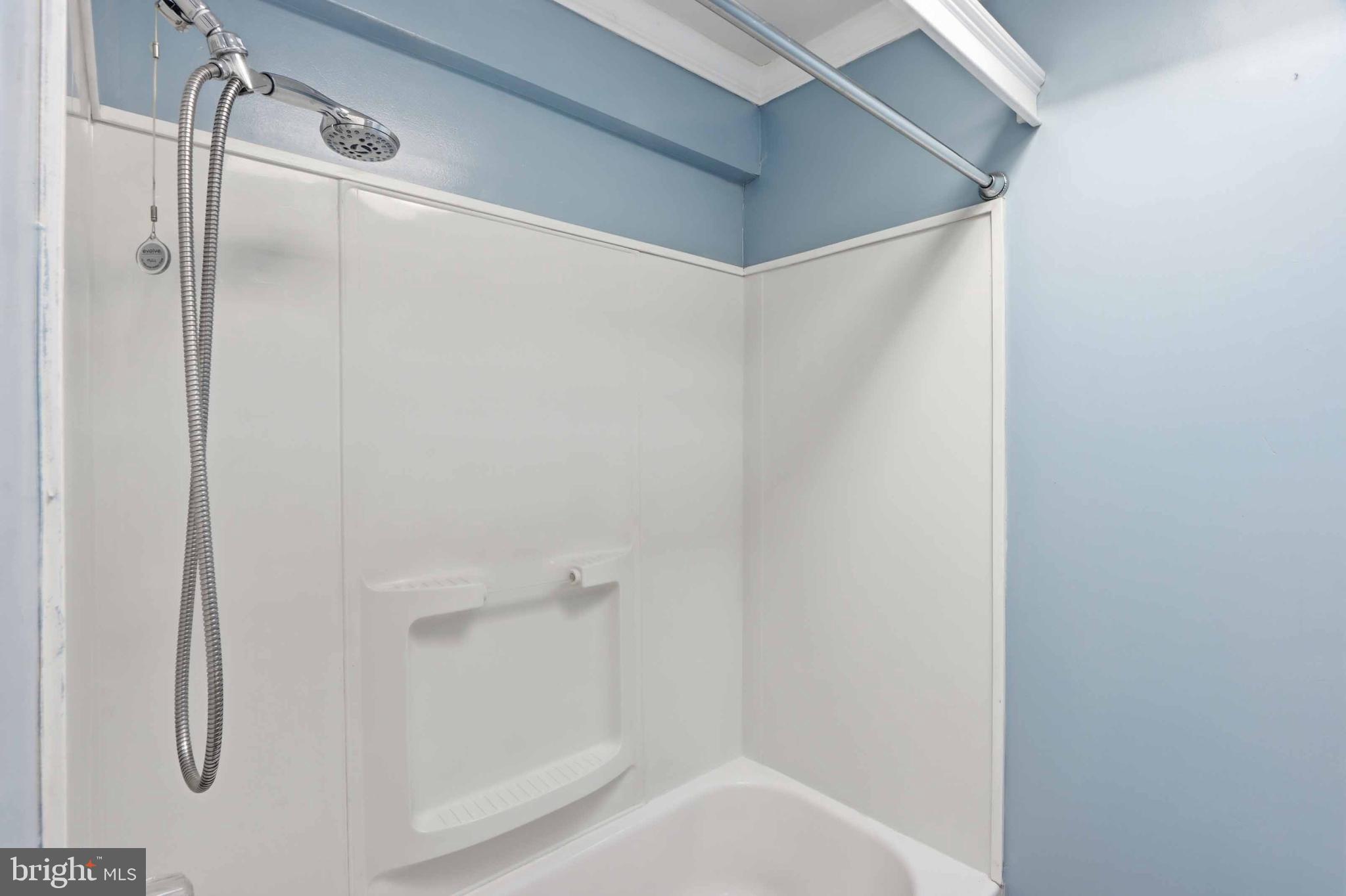 3547 Benzinger Road Baltimore, MD 21229 - Photo 19 of 24 a bathroom with a glass shower door