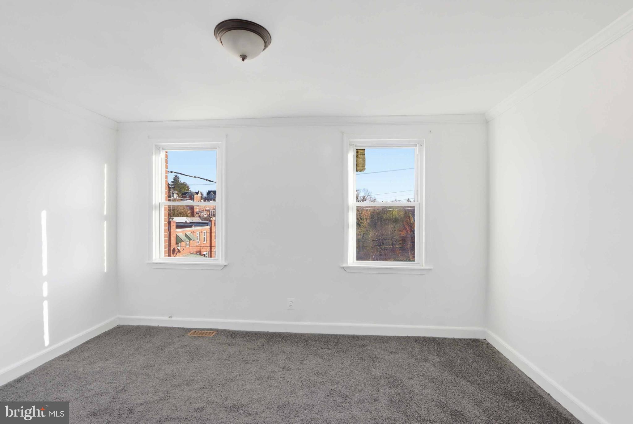 3547 Benzinger Road Baltimore, MD 21229 - Photo 20 of 24 an empty room with windows