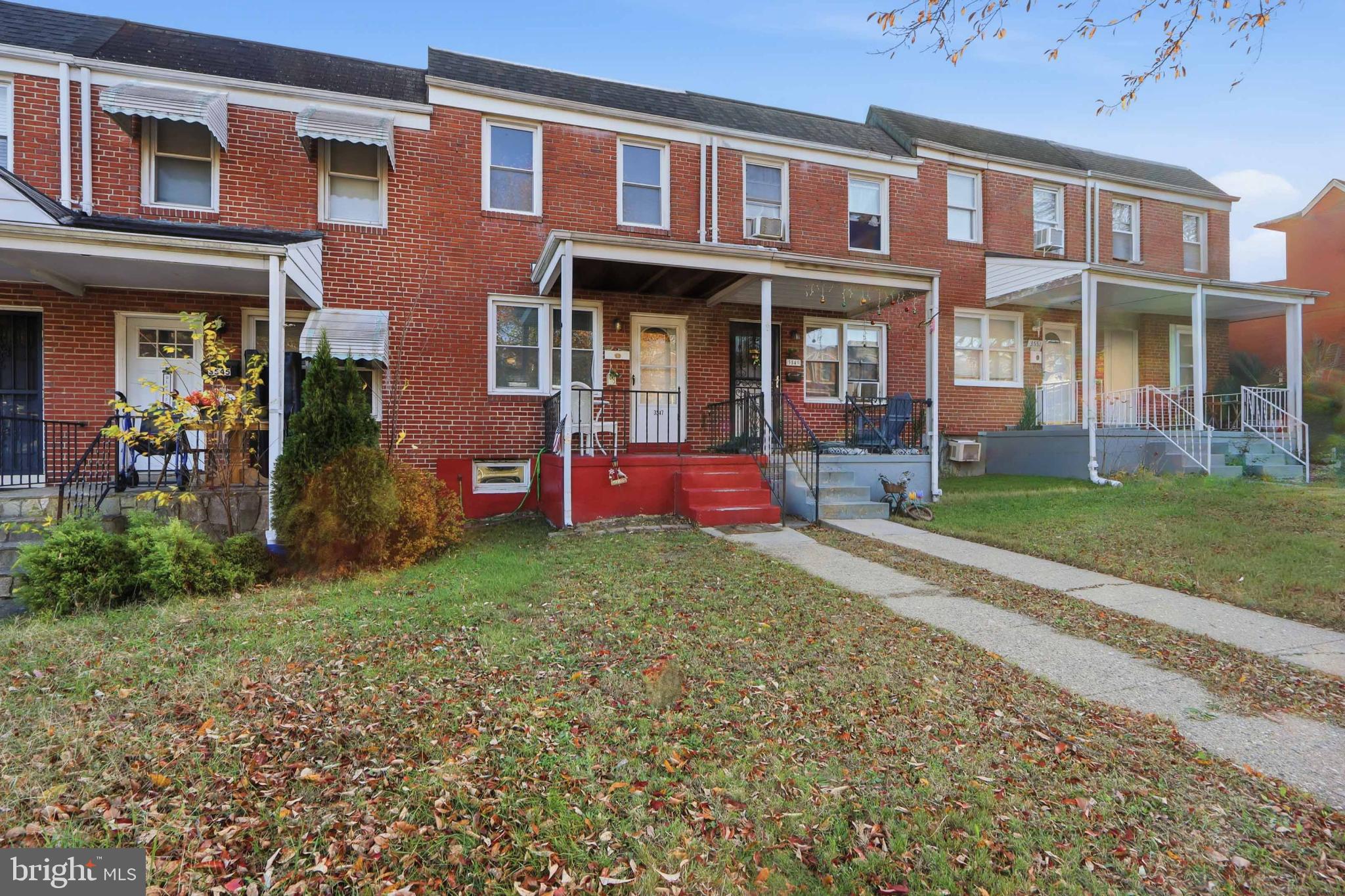 Charming brick townhomes with inviting porches.