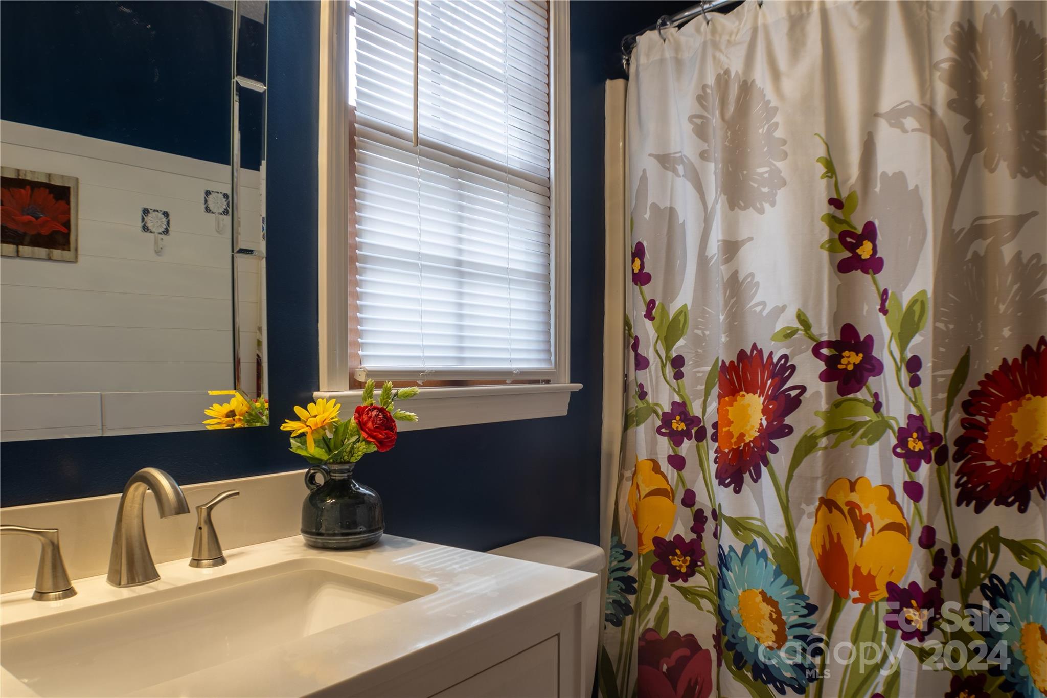 281 Jubal Reeves Circle, Unit 1465 Mount Gilead, NC 27306 - Photo 13 of 17 a bathroom with a sink a potted plant and a potted plant