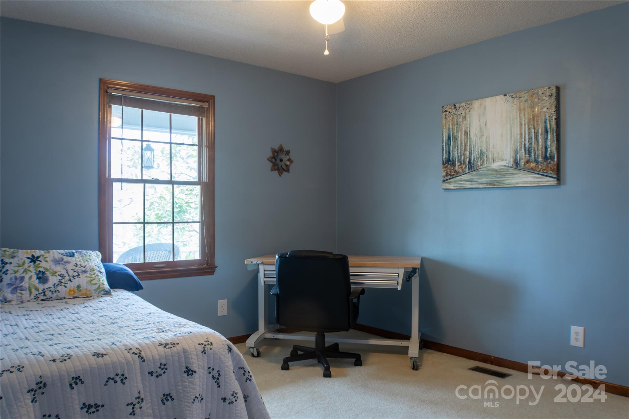 281 Jubal Reeves Circle, Unit 1465 Mount Gilead, NC 27306 - Photo 15 of 17 a bedroom with a bed and a window