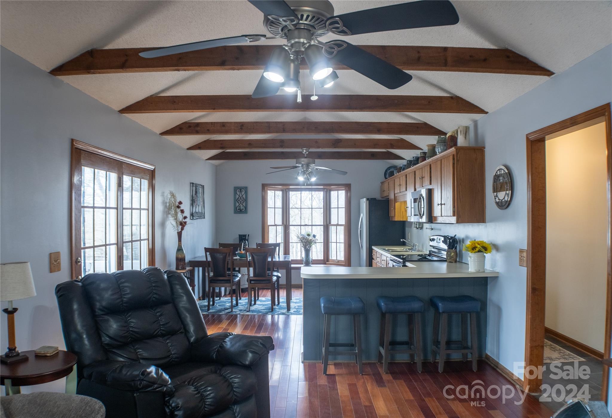 281 Jubal Reeves Circle, Unit 1465 Mount Gilead, NC 27306 - Photo 9 of 17 a living room with furniture and a chandelier