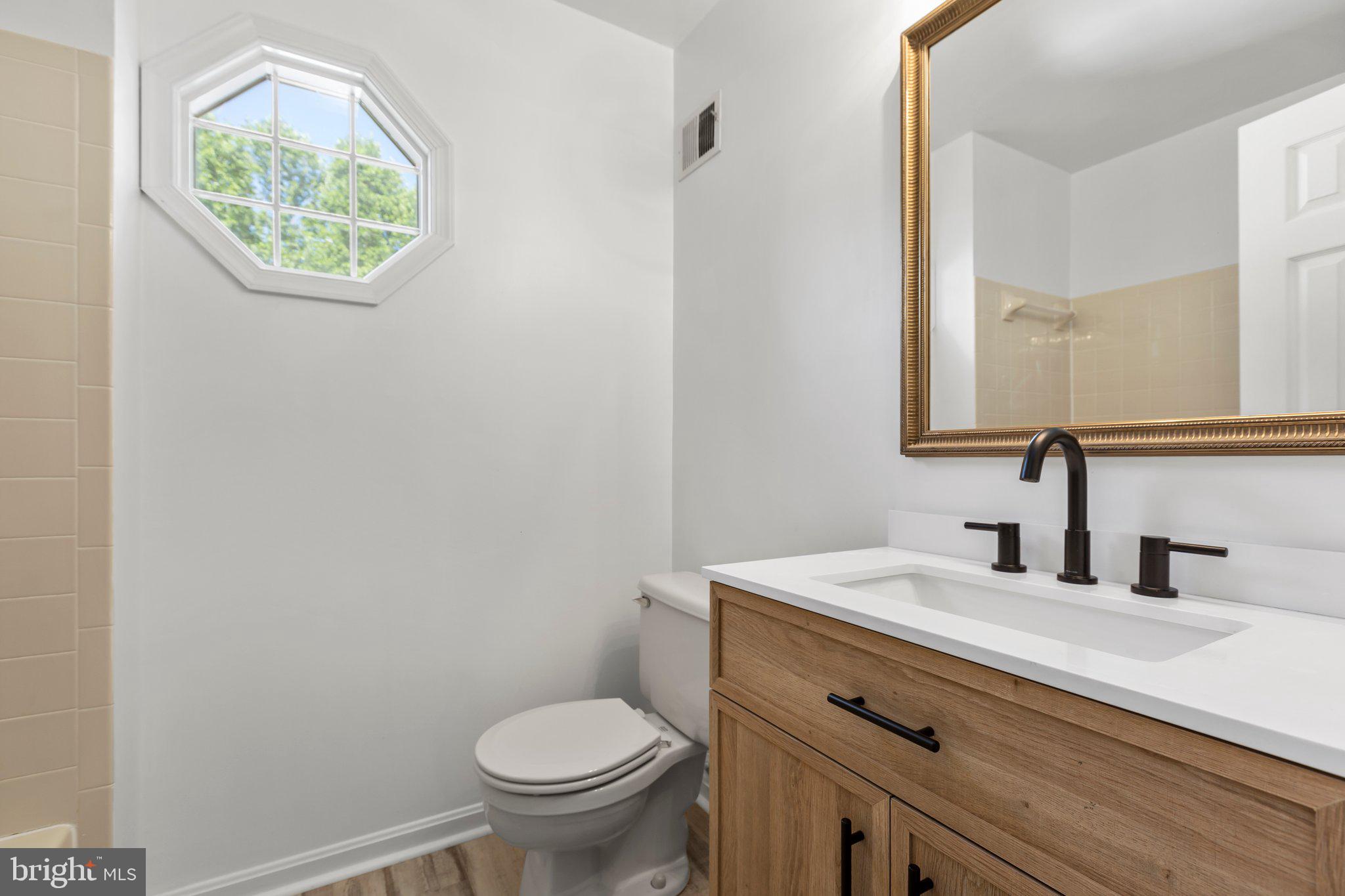 235 Choptank Road Stafford, VA 22556 - Photo 25 of 46 Main bathroom new flooring and vanity and paint