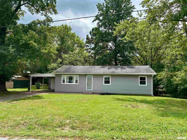 a house view with a garden space