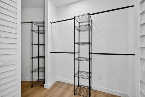 a view of staircase with white walls and window