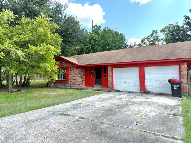 a view of a house with a yard and garage