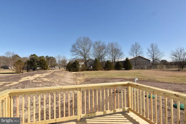 a view of a balcony with wooden floor