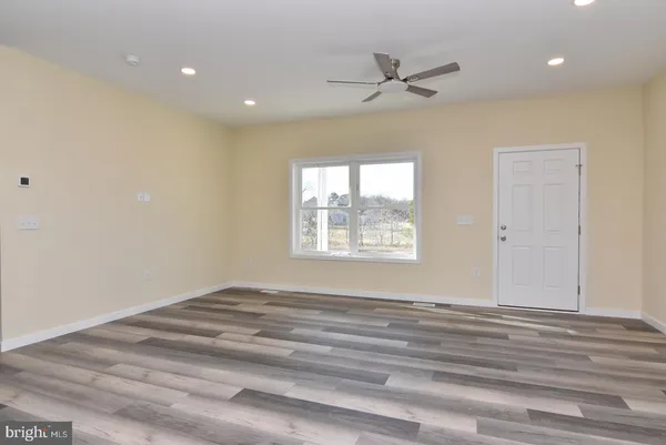 a view of an empty room and a window