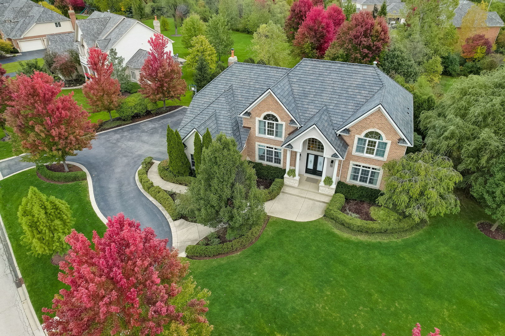 403 Old Mill Circle Lincolnshire, IL 60069 - Photo 1 of 4 a front view of a house with a yard and garden