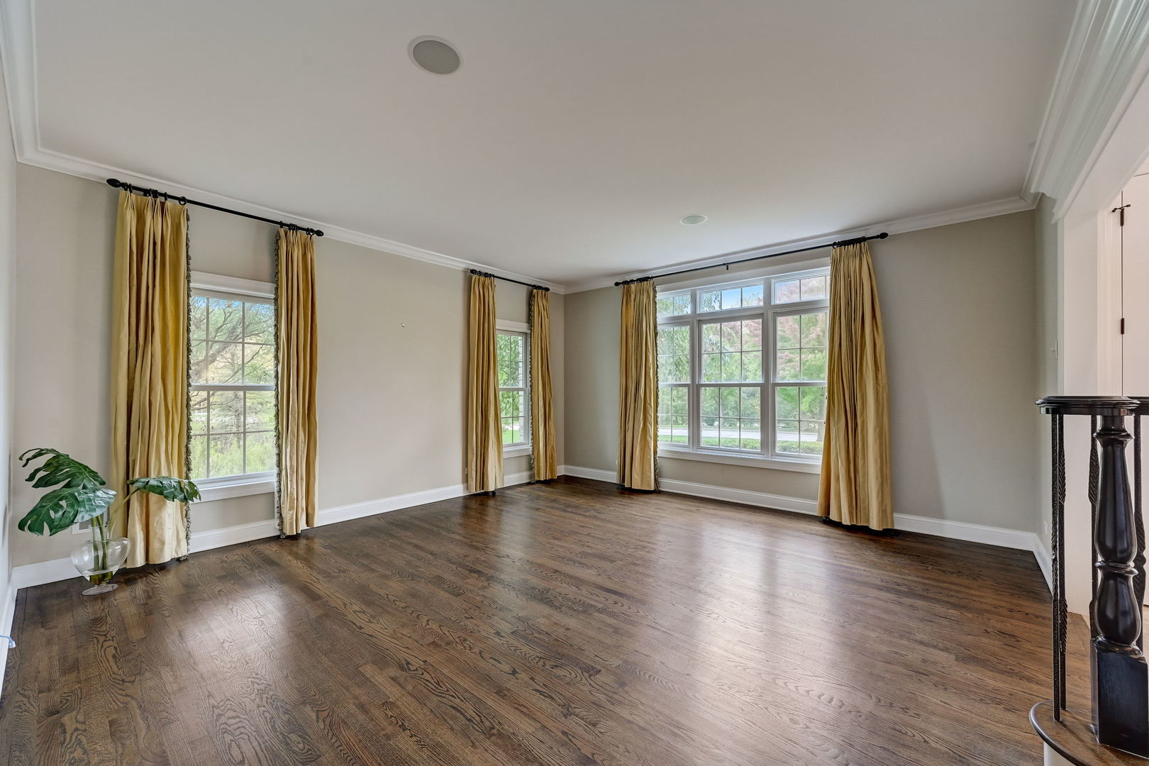 403 Old Mill Circle Lincolnshire, IL 60069 - Photo 4 of 4 an empty room with wooden floor and windows