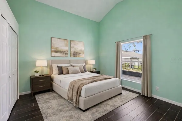 a bedroom with a bed and window