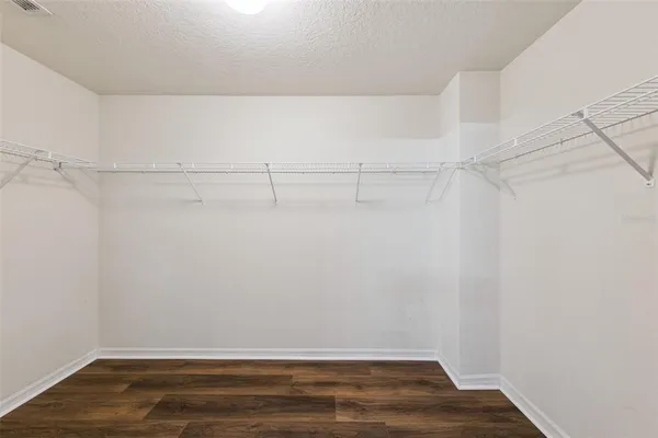 a view of a room with racks on the wall