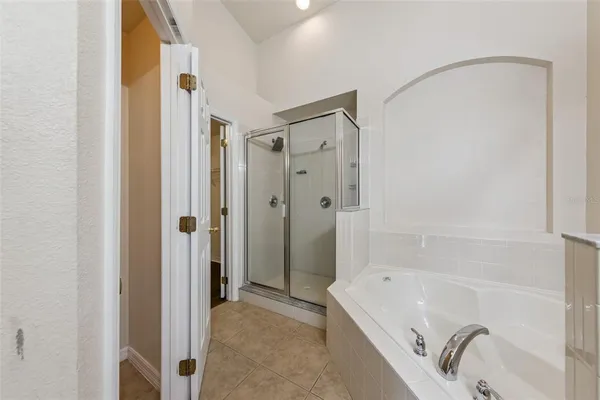 a bathroom with a tub and a shower