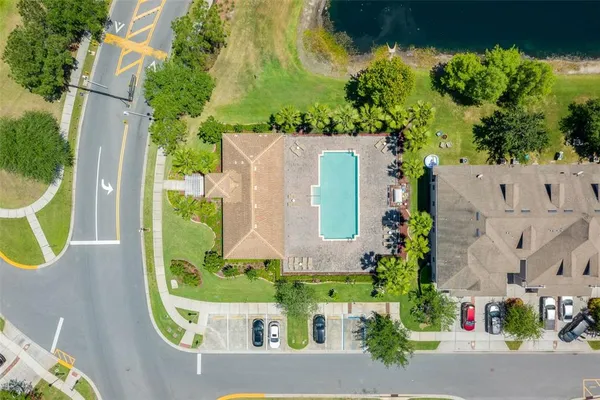 an aerial view of a house with a swimming pool