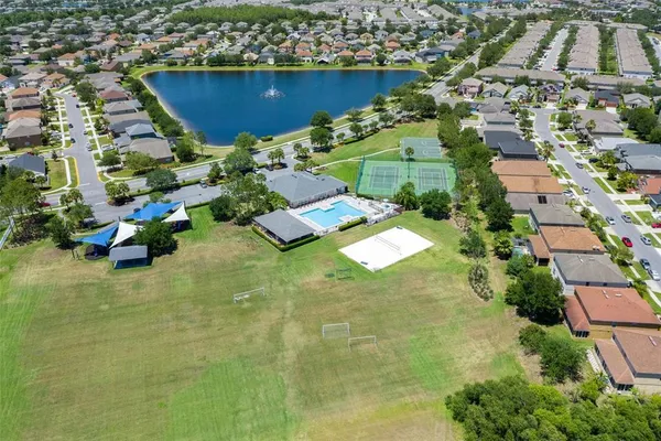 an aerial view of residential houses with outdoor space