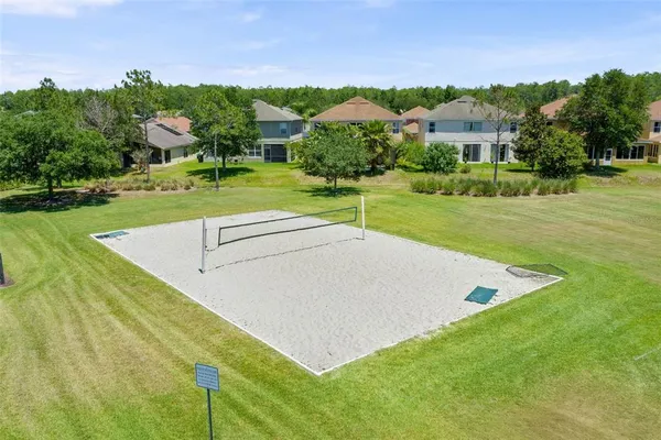 a view of a house with pool and a yard