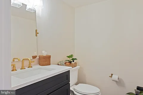a bathroom with a double vanity sink mirror and