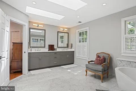 a bedroom with a bed and a chair